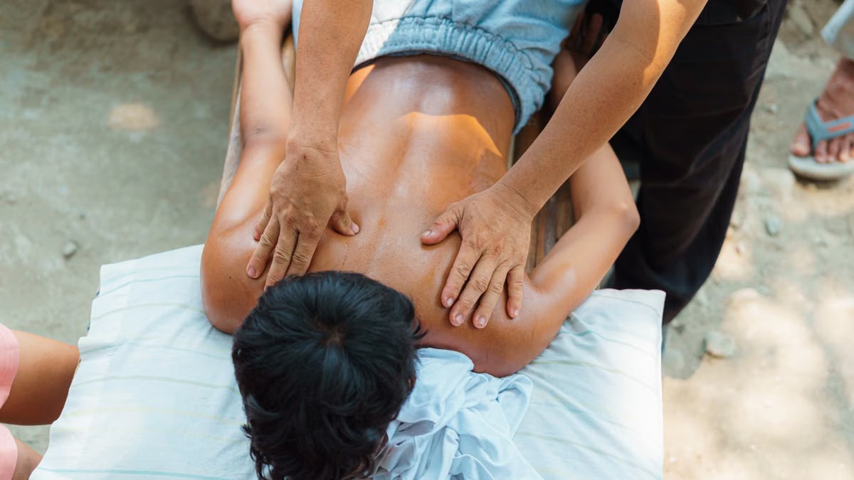 A relaxing outdoor back massage session providing stress relief and wellness benefits.